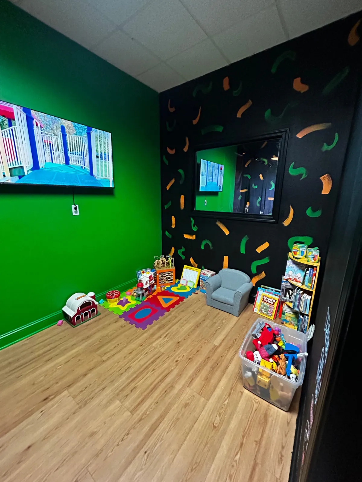 Kids play area at ReFuel Bootcamp with toys, books and a TV