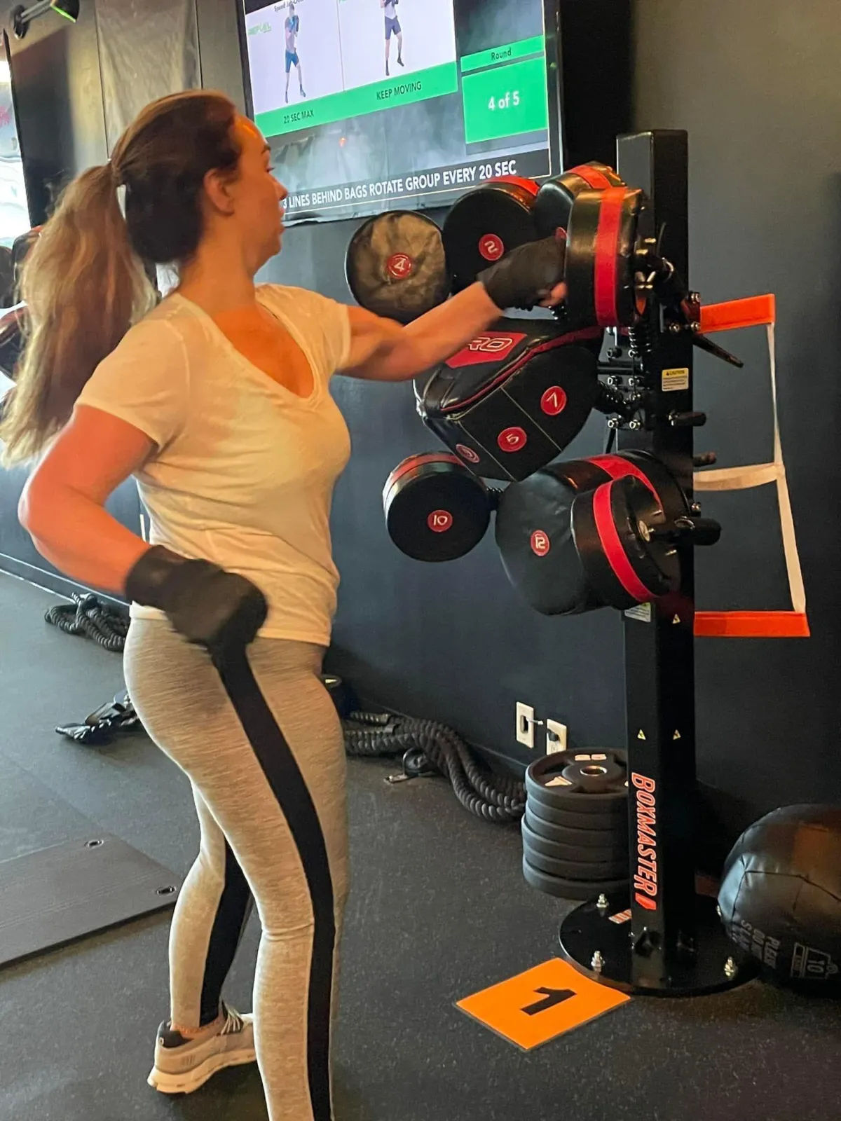 Member working the boxing station at ReFuel Bootcamp