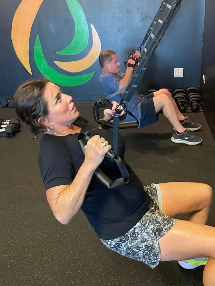 Members using suspension trainers at ReFuel Bootcamp